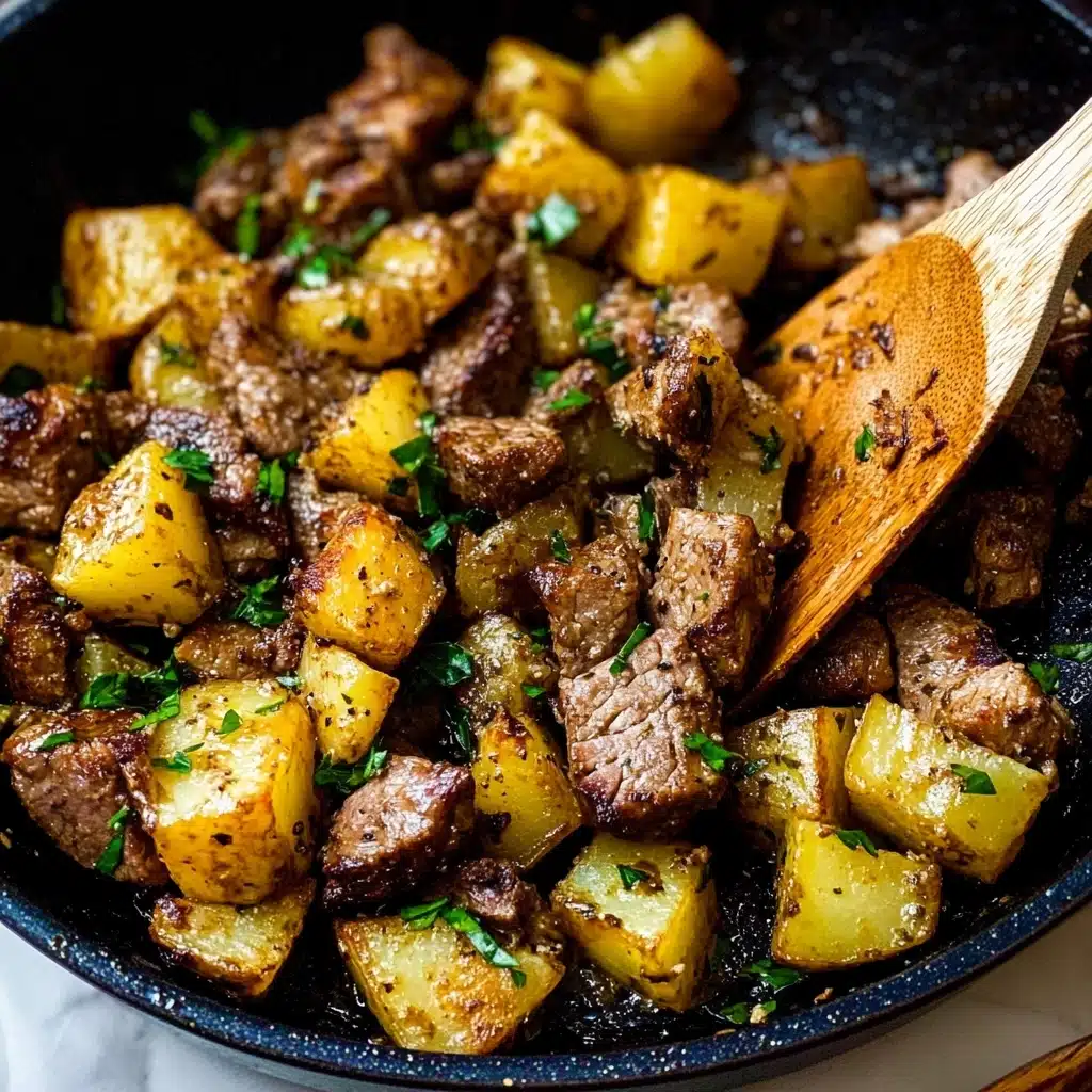 Garlic Butter Steak Bites and Potatoes, Steak Bites and Potatoes, Easy Steak and Potato Dinner, One-Skillet Steak and Potatoes, Quick Weeknight Steak Dinner The image shows a close-up view of a cooked meat and potato dish in a black pan. The dish has two main layers: the bottom layer consists of golden brown potato chunks with a slightly crispy texture and sprinkled with small green herb pieces. The top layer has browned pieces of meat, also sprinkled with herbs, mixed evenly among the potatoes. Some parts of the potatoes and meat have a light char, giving a darker brown color. A wooden spatula with a warm wood grain texture rests on the right side, partially lifting some of the food. The overall color tones are warm with brown, yellow, and green hues. The pan is set on a white marbled surface.