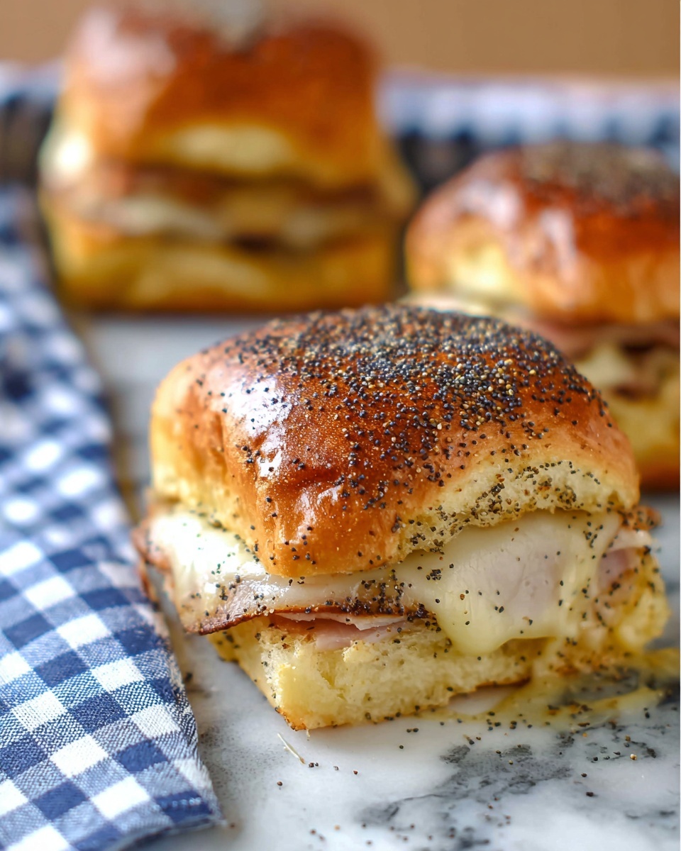A close-up view of a sandwich on a shiny, golden-brown bread roll topped with black poppy seeds. The sandwich is layered with melted cheese that stretches over slices of light-colored meat, all inside the soft, slightly glossy bread. Behind it, there are two more sandwiches stacked on each other, and a blue and white checkered cloth is visible in the background. The sandwich is placed on a surface with a white marbled texture. photo taken with an iphone --ar 4:5 --v 7