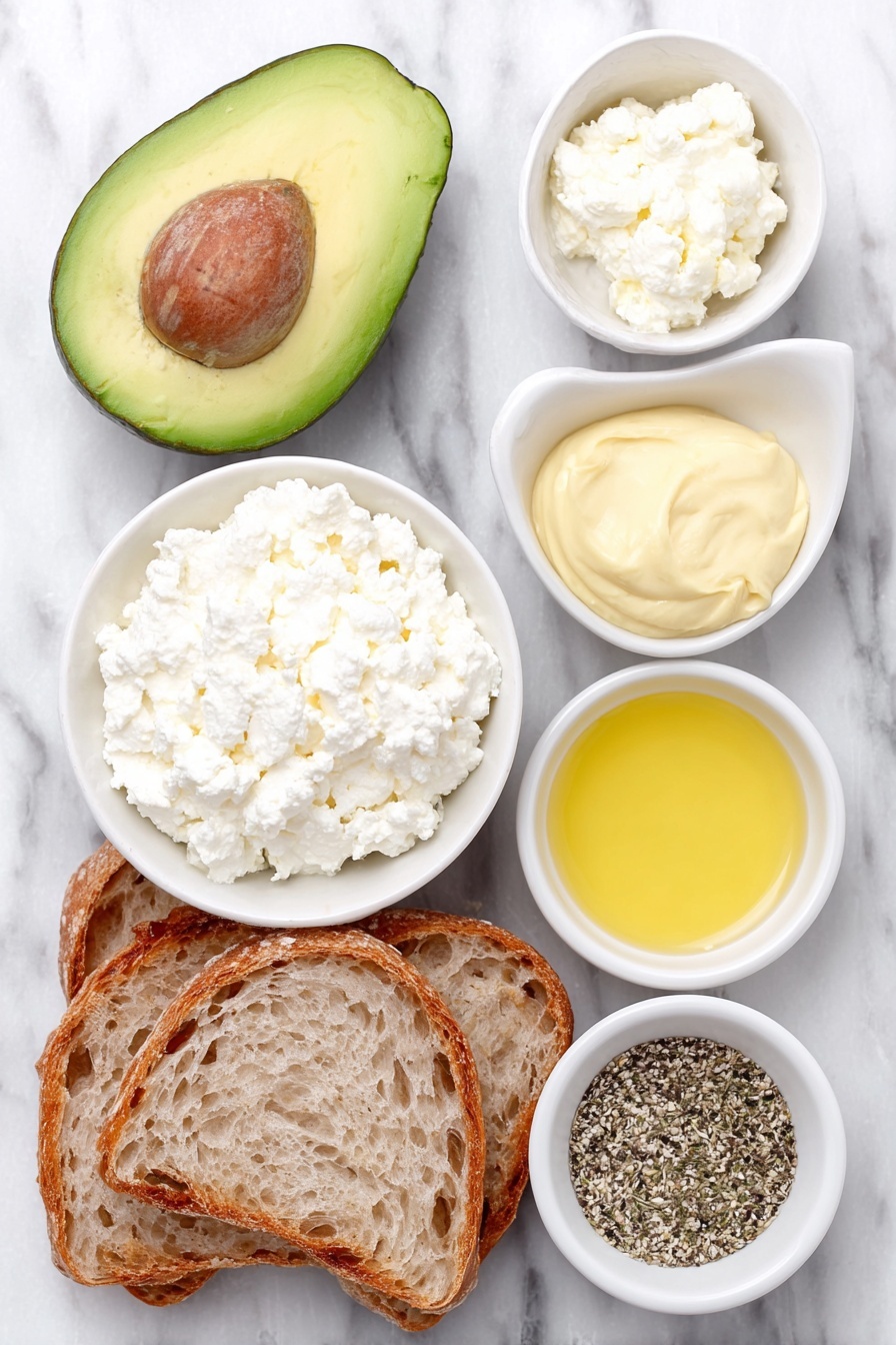 Flat lay of a halved ripe avocado with its pit removed, a small white ceramic bowl filled with creamy cottage cheese, a small white bowl containing fresh lemon juice, a small white bowl holding Dijon mustard, a small white bowl with golden honey, a small white bowl with mixed Everything but the Bagel seasoning, and two slices of rustic sourdough bread arranged symmetrically, all placed on a clean white marble surface, soft natural light, photo taken with an iPhone, professional food photography style, fresh ingredients, white ceramic bowls, no bottles, no duplicates, no utensils, no packaging --ar 2:3 --v 7 --p m7354615311229779997 - Creamy Avocado Cottage Cheese Toast, healthy avocado toast, quick breakfast ideas, nutritious snack recipes, easy vegan toast